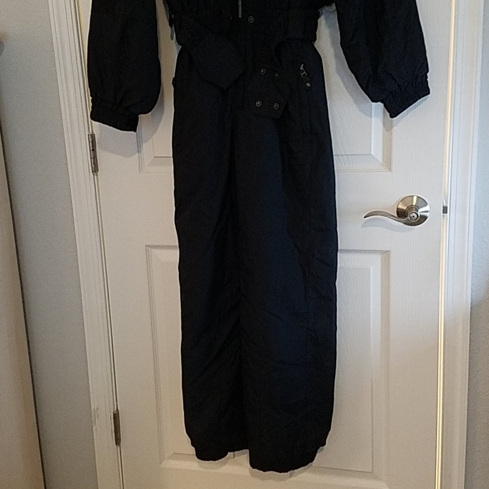 One piece belted ski suit